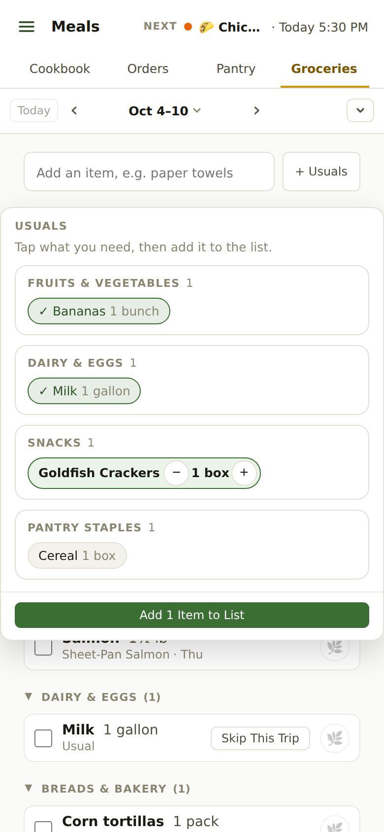 The Usuals menu grouped by aisle: Bananas and Milk already on the list, Goldfish Crackers picked with − and + for the amount, and a green Add 1 Item to List button.