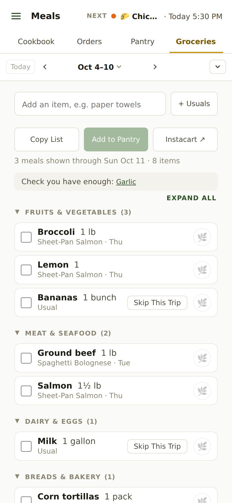 The grocery list on a phone: an add box, + Usuals, Copy List, Add to Pantry and Instacart buttons, then items grouped by aisle, each showing which dinner needs it, like Broccoli 1 lb for Sheet-Pan Salmon on Thursday.